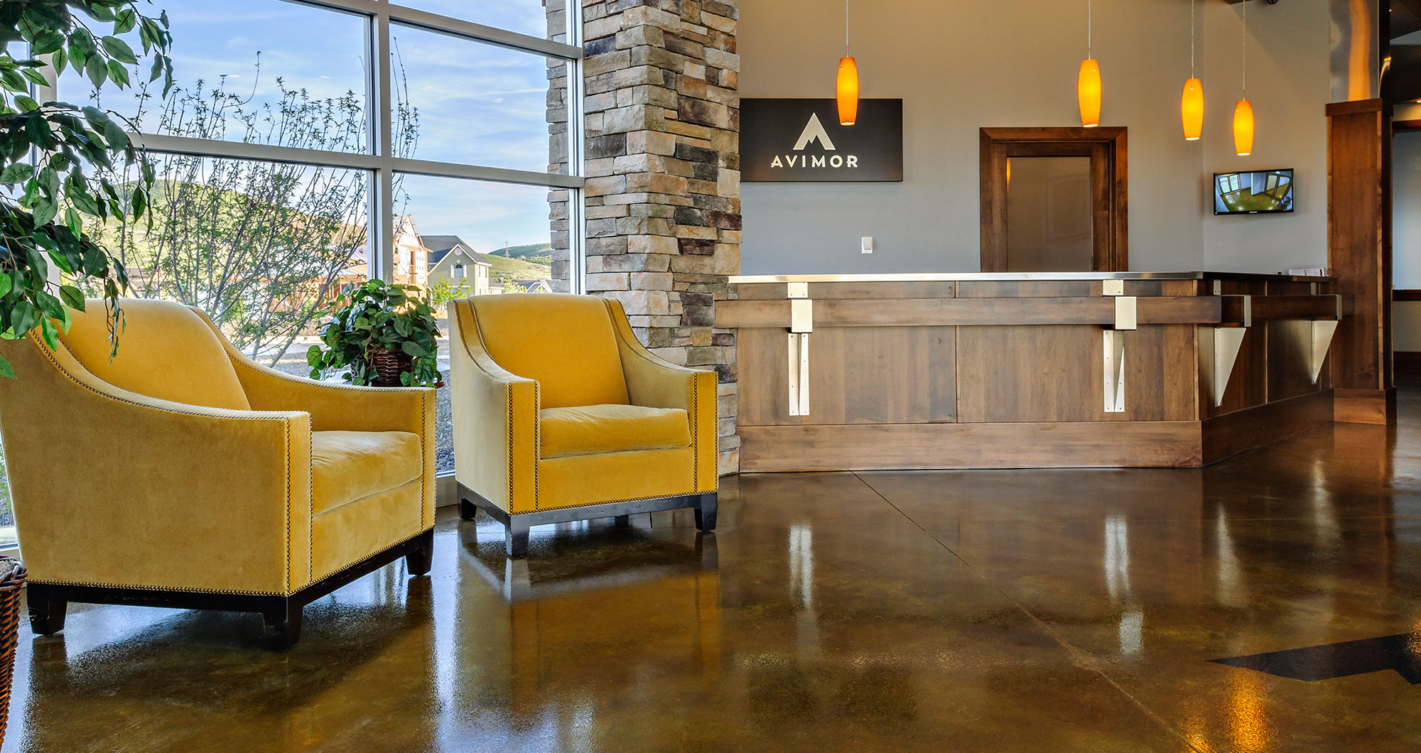 Avimor clubhouse and community center lobby with stone and hardwood finishes
